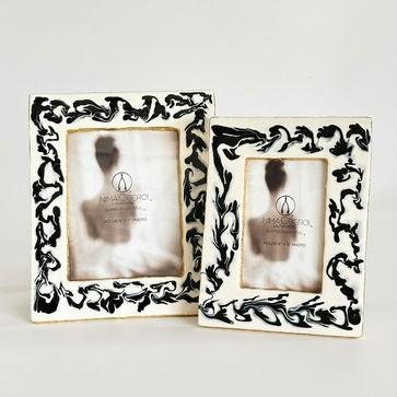 Two decorative picture frames with intricate black patterns on a white background